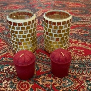 Two decorative glass candle holders with candle included. See photos for details